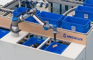 Mecalux komplektēšanas robots pilnībā automatizē pasūtījumu komplektēšanu Mecalux komplektēšanas robots pilnībā automatizē pasūtījumu komplektēšanu